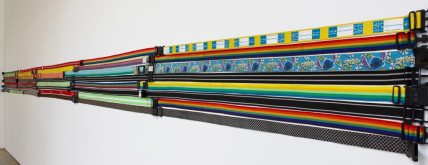 Longhui Zhang, Long Way from Home, 2016, luggage straps, found objects